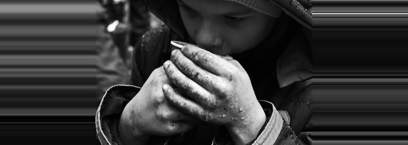 The problem of street children orphans. Beggar refugees on the streets of the city.