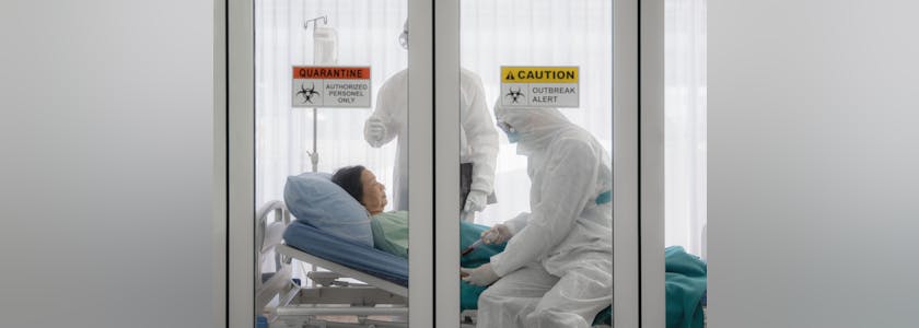 coronavirus covid-19 infected patient on bed in quarantine room with quarantine and outbreak alert sign at hospital with disease control experts make disease treatment, coronavirus outbreak control