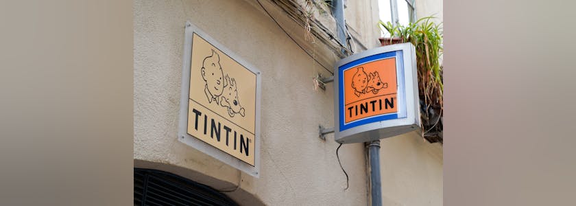 Tintin text brand and logo sign store of comic hero shop sell book comics toys and souvenirs store
