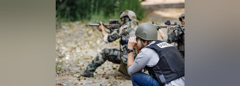 Photojournalist documenting war conflict